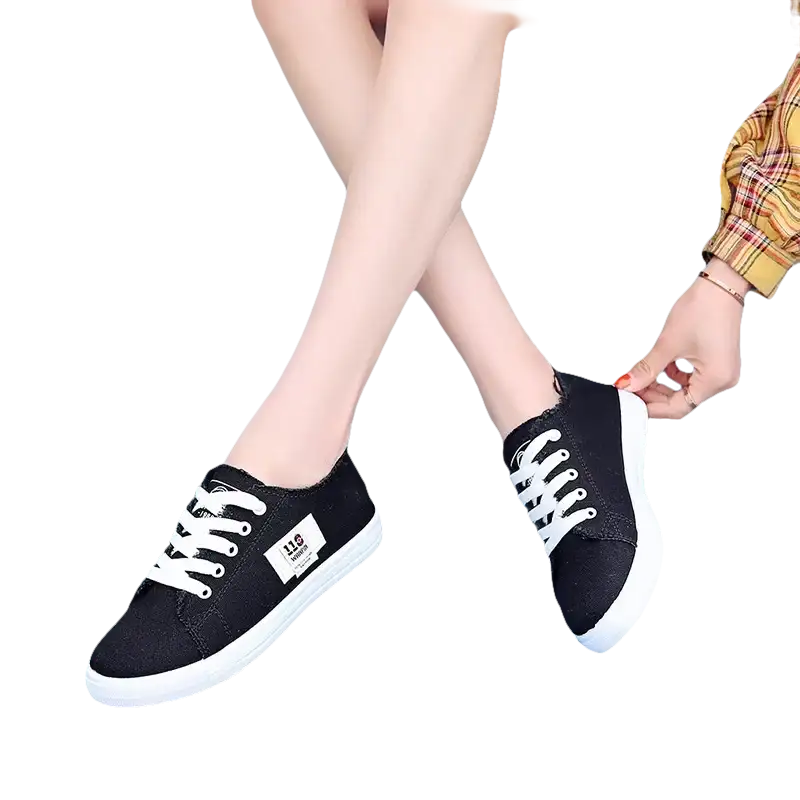 Black canvas sneakers with white laces.