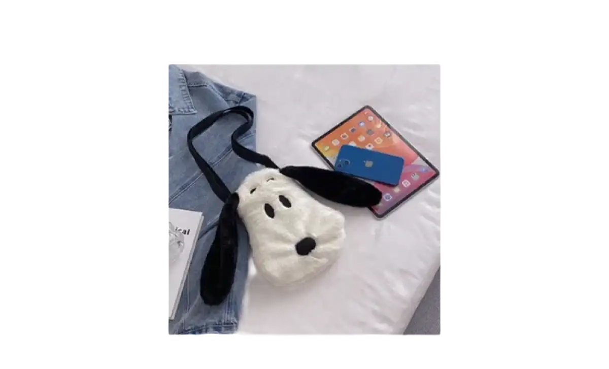 Dog-shaped plush purse with black strap and floppy ears.