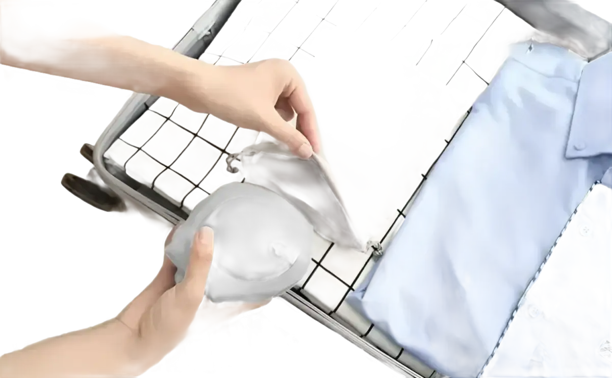 Suitcase being packed with Airpillo Inflatable Neck Pillow with Trendy Chill Vibes outdoors