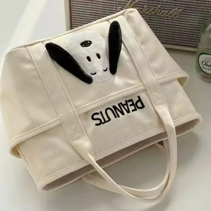 Canvas tote bag with Snoopy design.