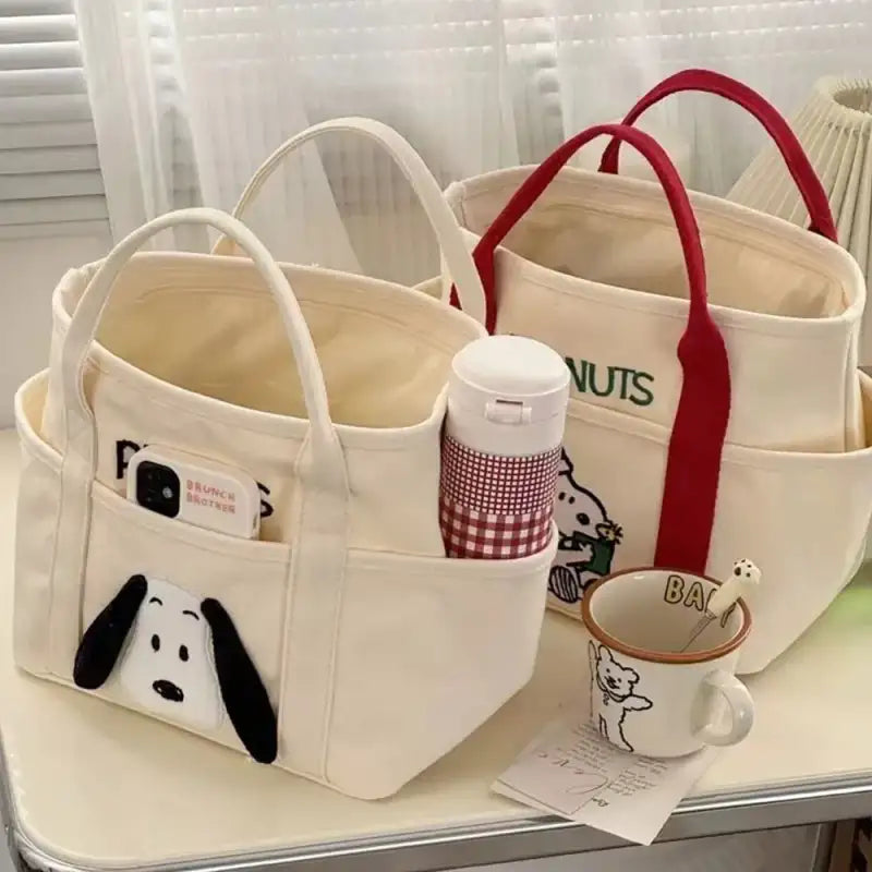 Canvas tote bags with cartoon designs.