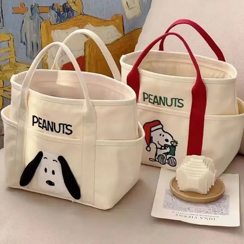 Two canvas tote bags with Snoopy designs.