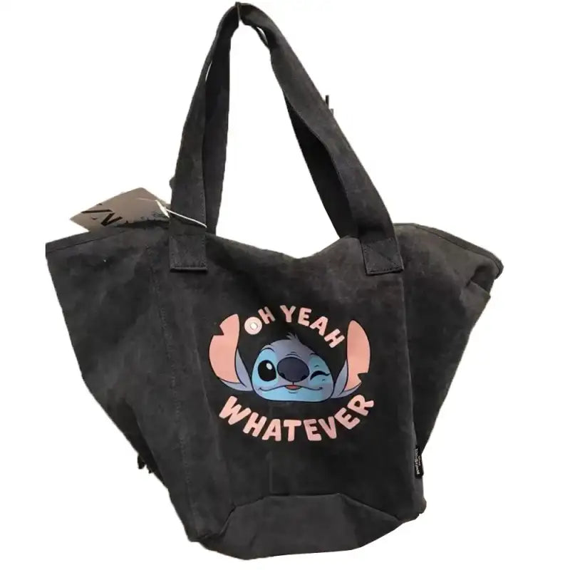 Black tote bag with Stitch graphic.