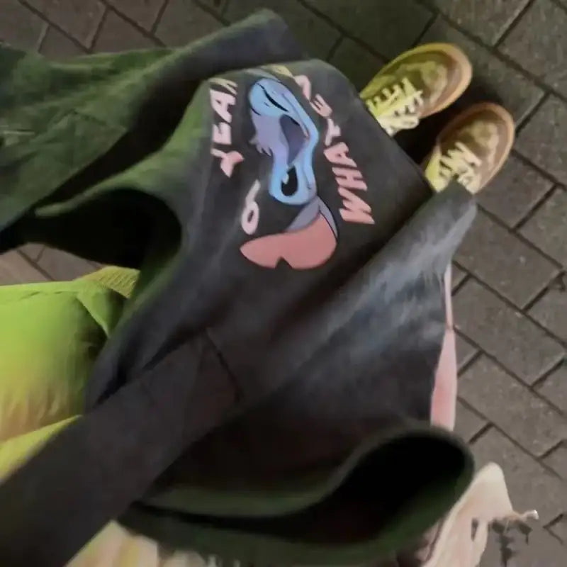Gray sweatshirt with cartoon character.