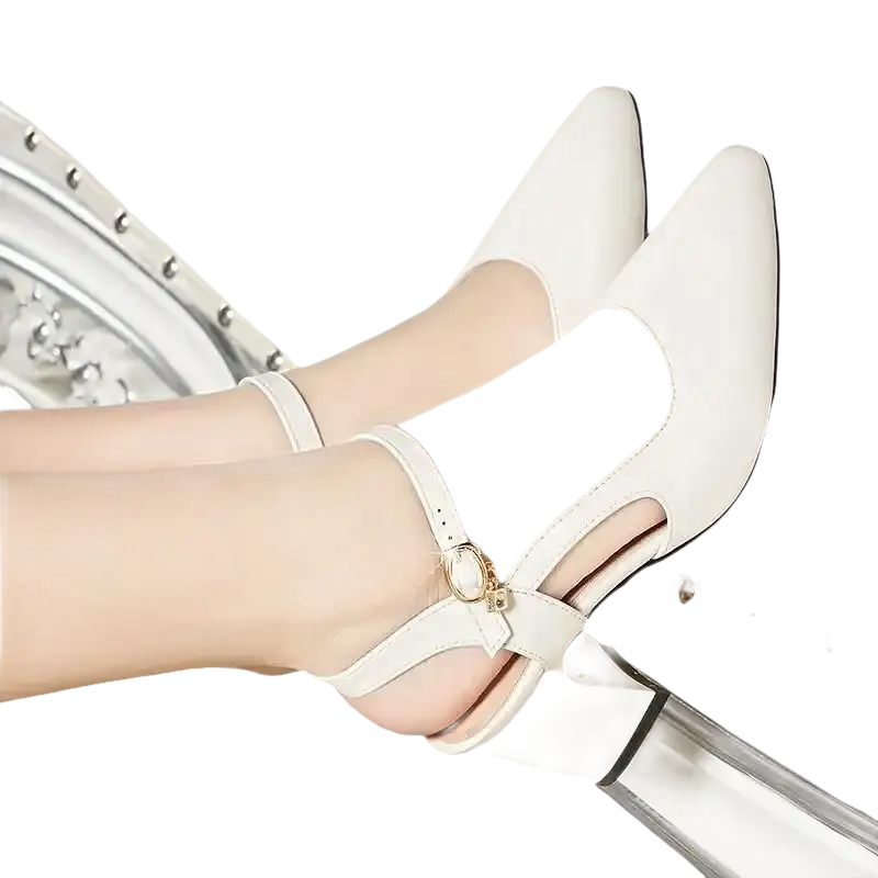 White leather pointed-toe heels.
