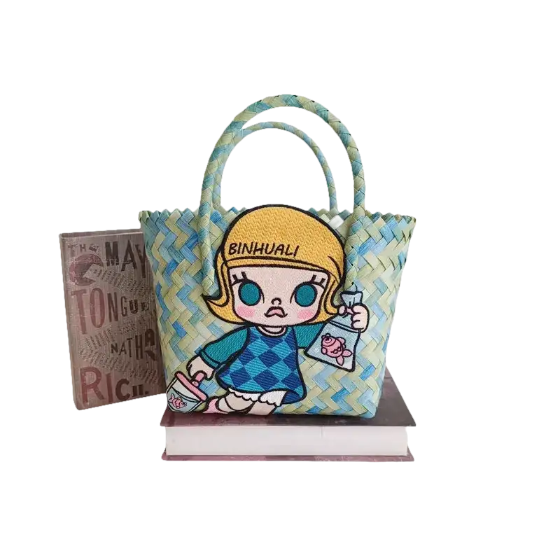 Woven handbag with cartoon girl patch.