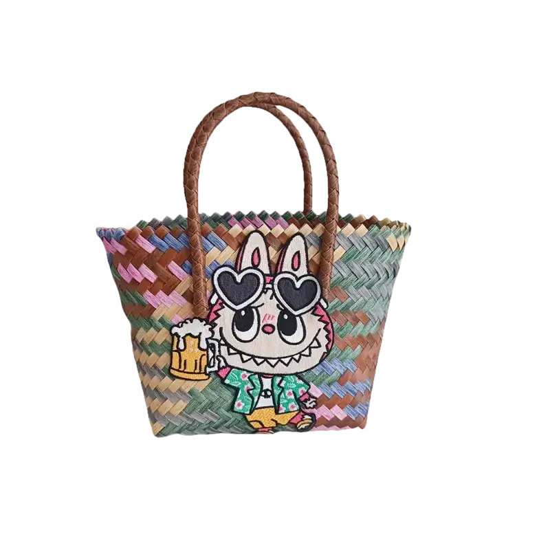 Woven tote bag with cartoon bunny patch.
