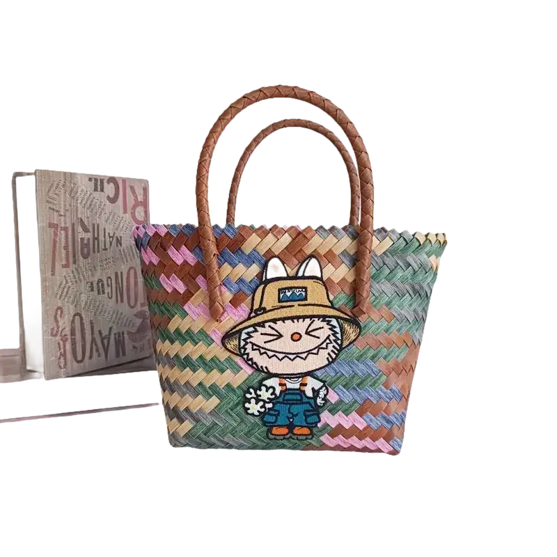 Colorful woven tote bag with cartoon patch.