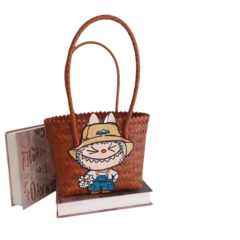 Brown woven tote bag with cartoon patch.