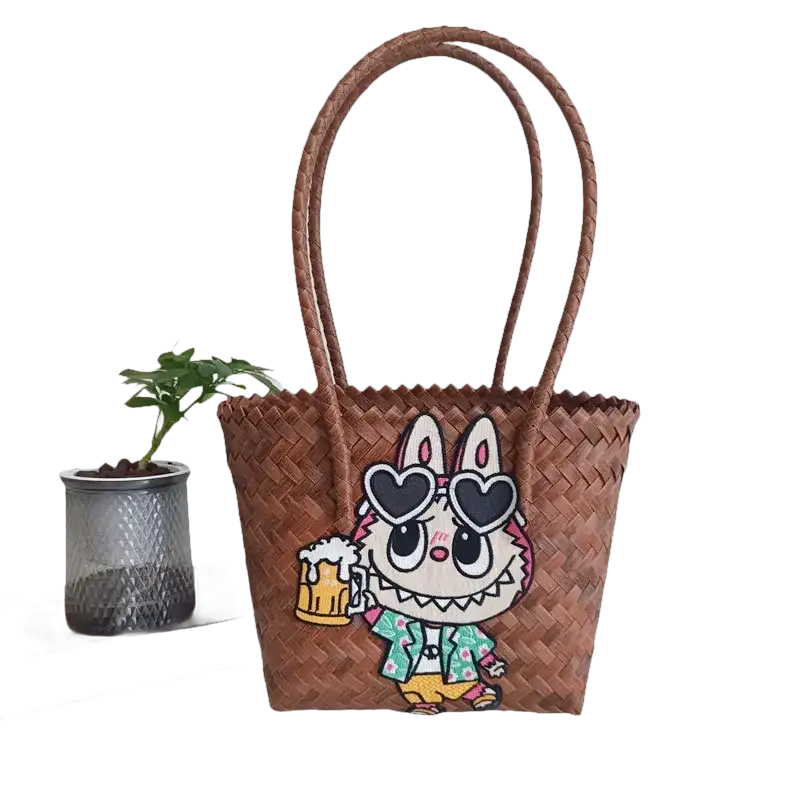 Brown woven tote bag with cartoon patch.