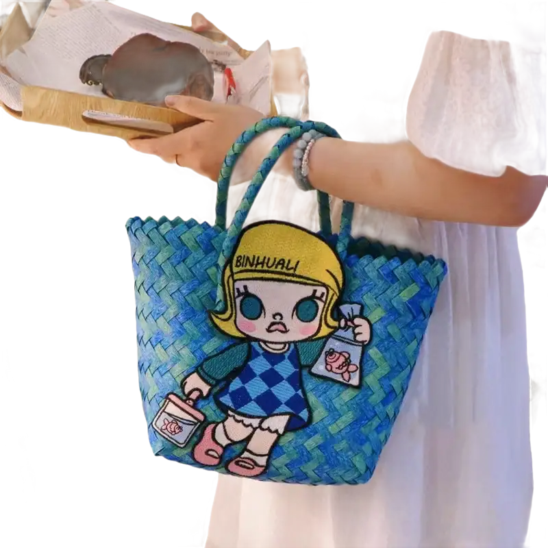 Blue woven tote bag with cartoon patch.