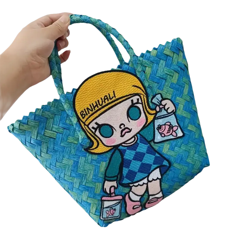 Blue woven tote bag with cartoon girl.