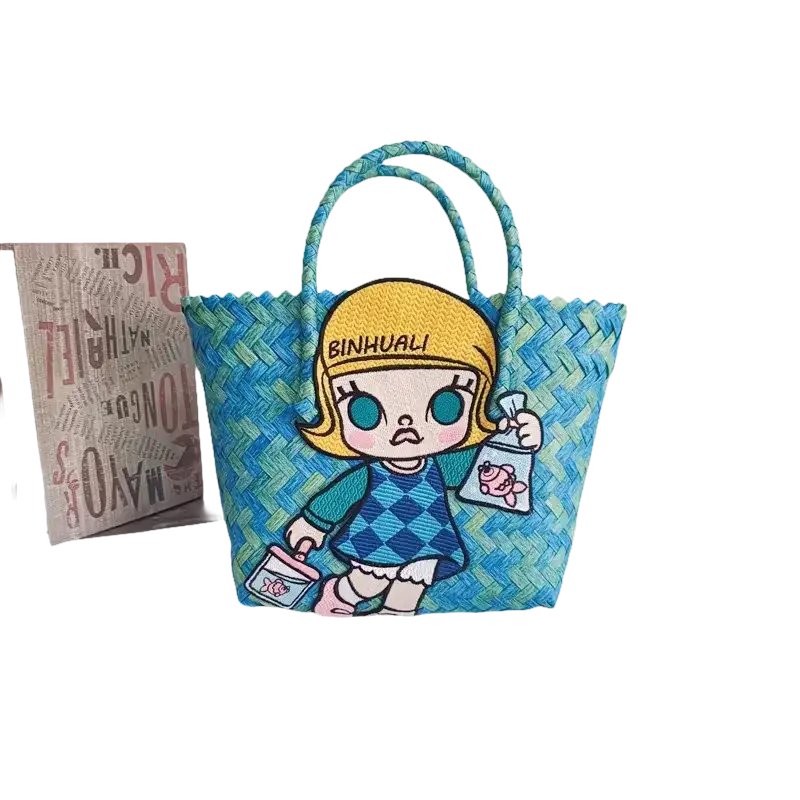 Blue woven tote bag with cartoon girl.