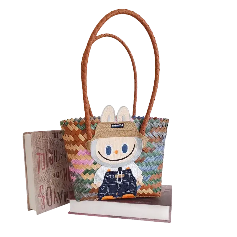 Woven tote bag with cartoon patch.