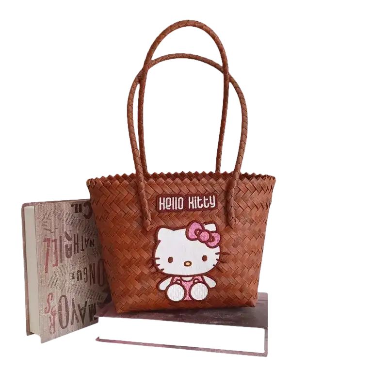 Brown woven handbag with Hello Kitty design.