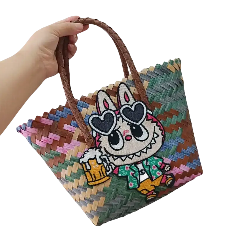 Woven tote bag with cartoon bunny patch.