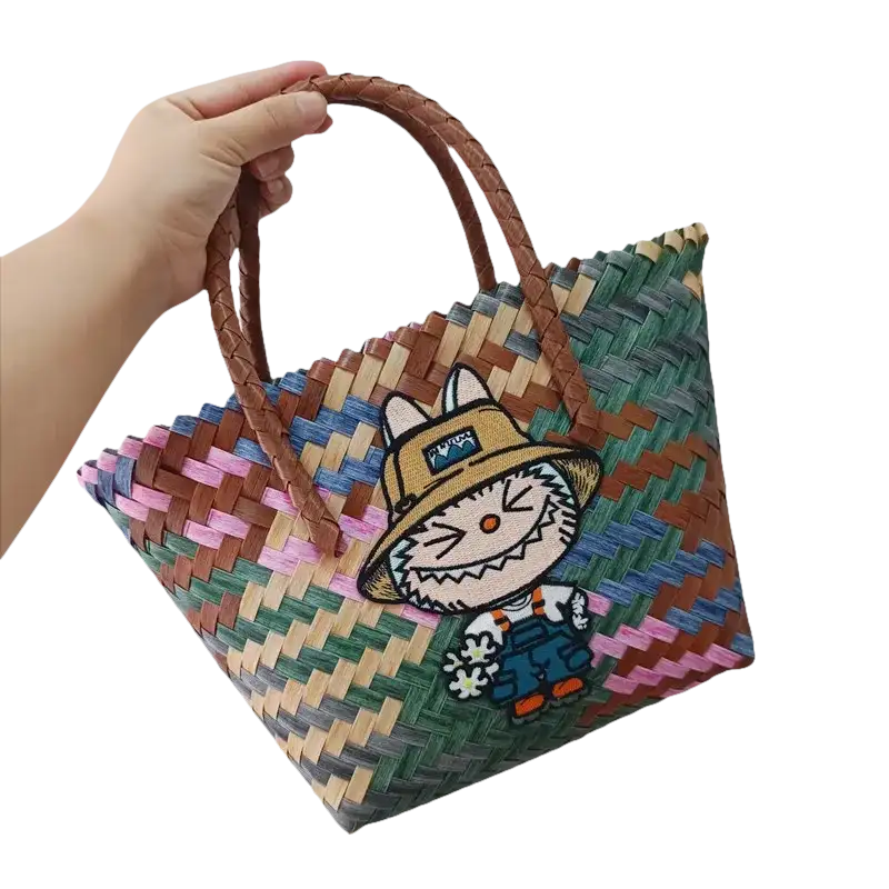 Woven tote bag with cartoon patch.