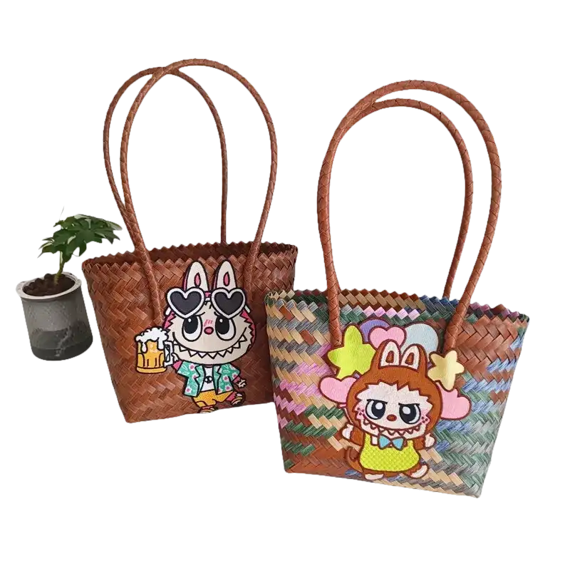 Two woven tote bags with cartoon embellishments.