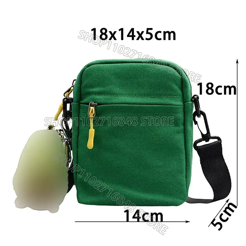 Green canvas crossbody bag.