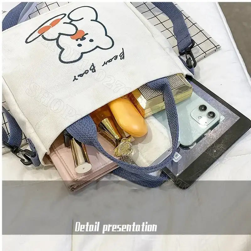 Canvas tote bag with bear design.