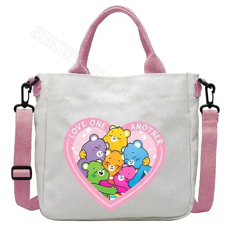 White tote bag with pink accents and Care Bears graphic.