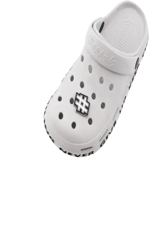 White clog with letter charms.