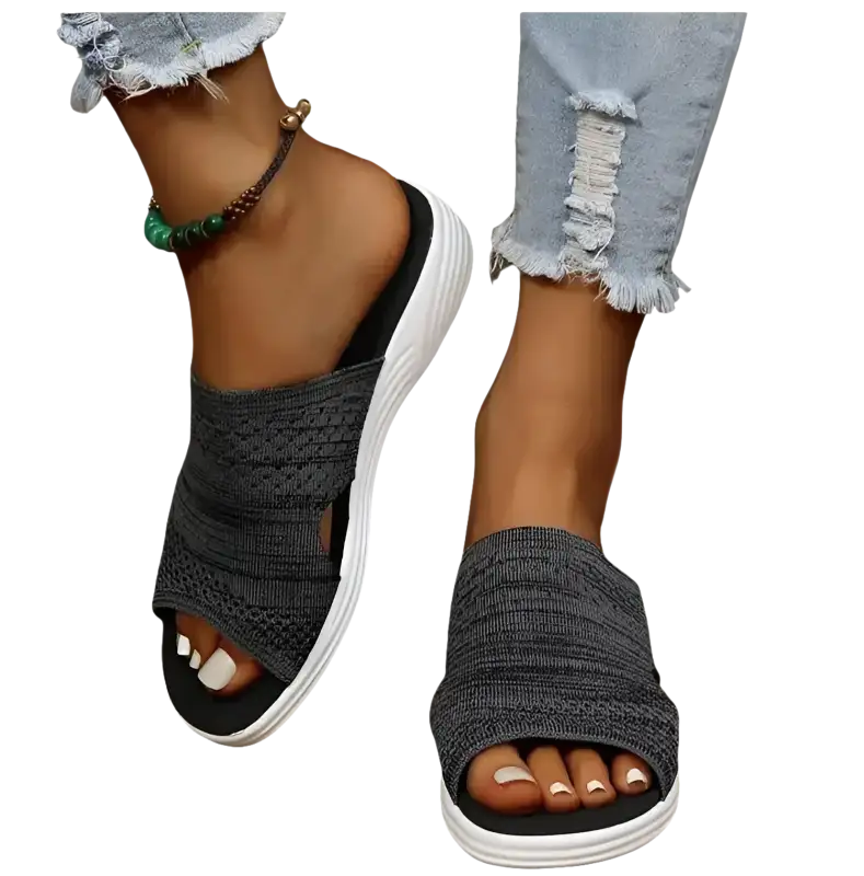 Gray knit slide sandals.