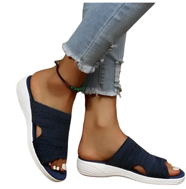 Navy knit slide sandals.