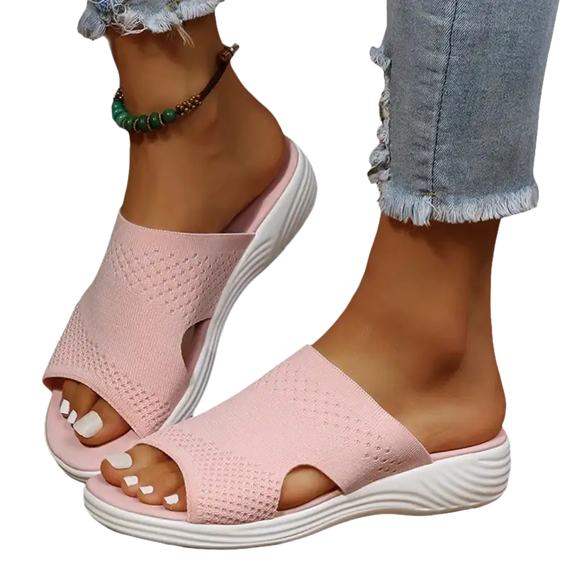 Pink knit slide sandals.