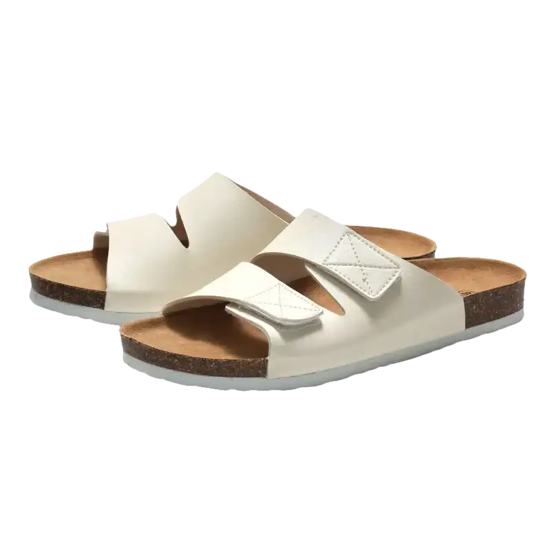 Pair of white slide sandals.