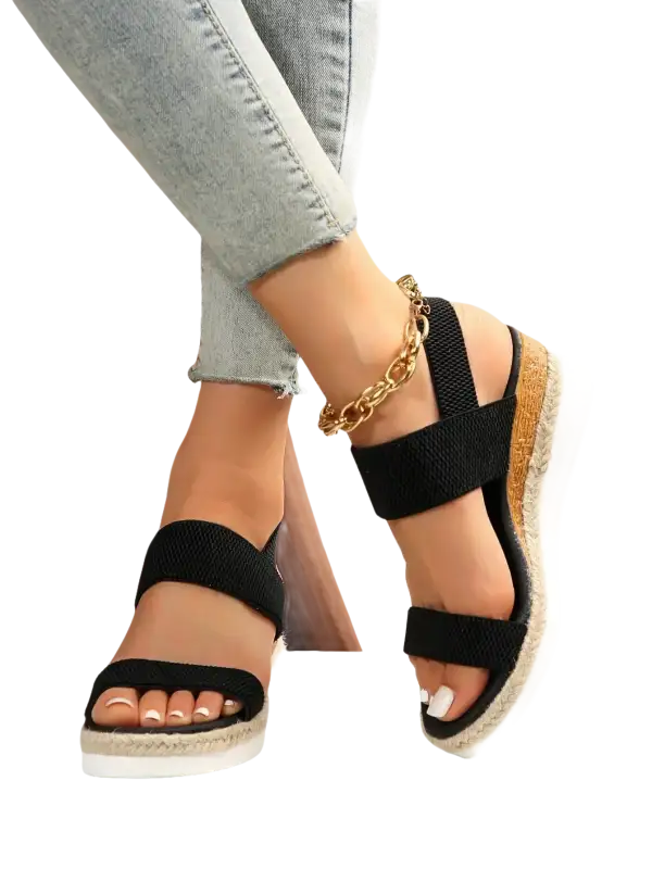 Black elastic platform sandals.