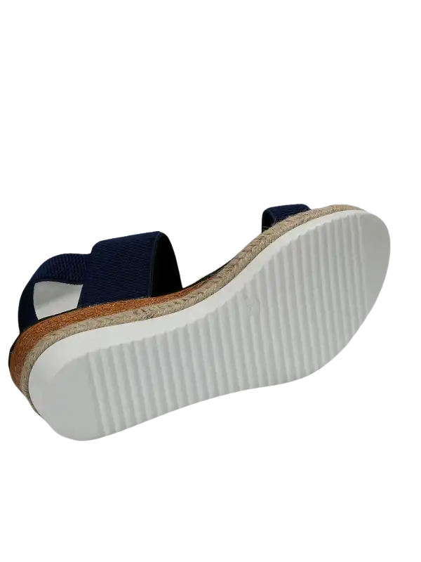 Navy blue elastic sandal with jute platform.