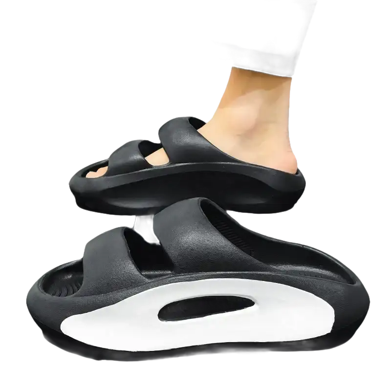 Black platform slide sandals.