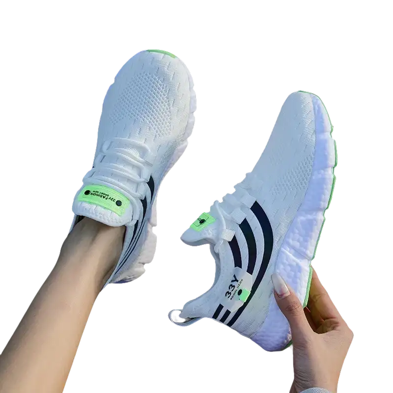 White athletic shoes with black stripes.