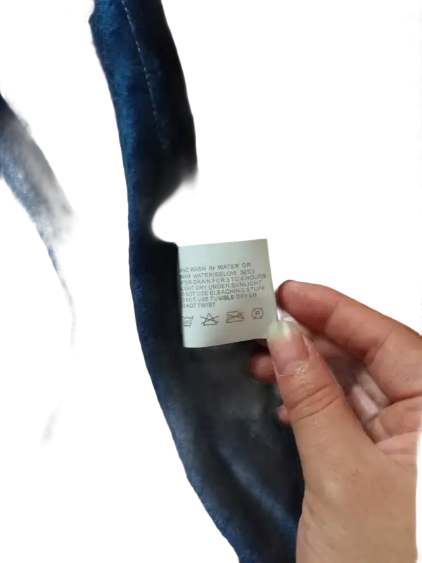 Blue velvet fabric with care tag.