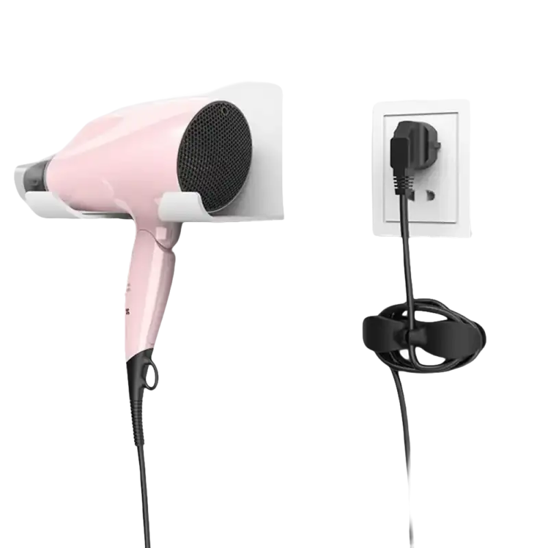 Pink hair dryer with wall mount and cord organizer.