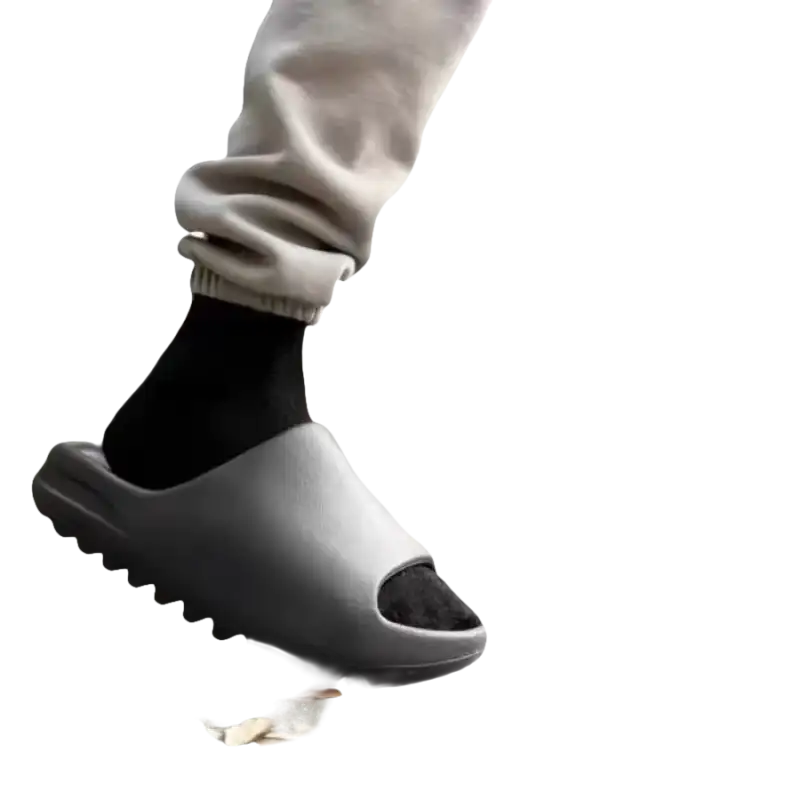 Gray slide sandals with black socks.