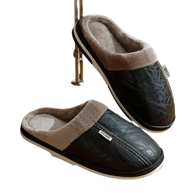 Black leather-look slippers with gray faux fur lining.