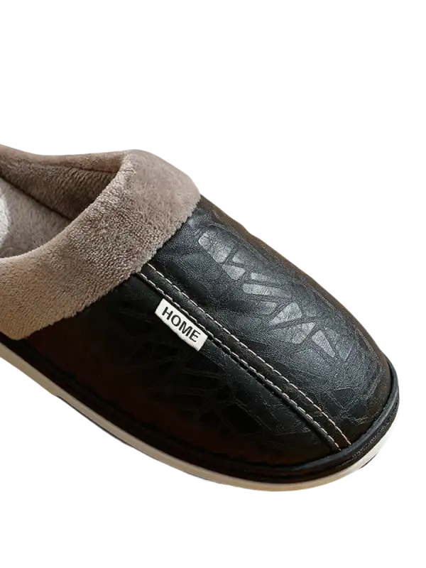 Black leather slipper with gray lining.