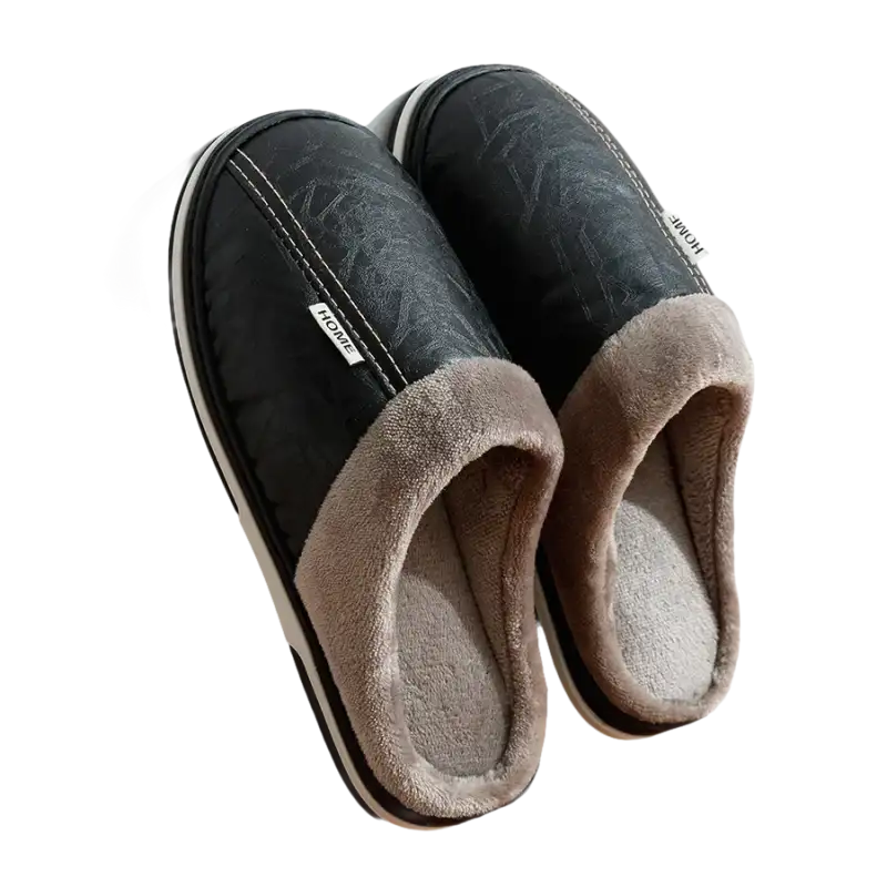 Pair of black leather-look slippers with gray plush lining.