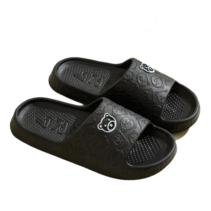 Black bear-patterned slide sandals.