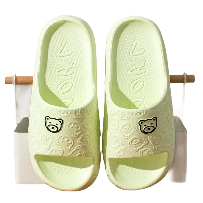 Green bear-themed slide sandals.