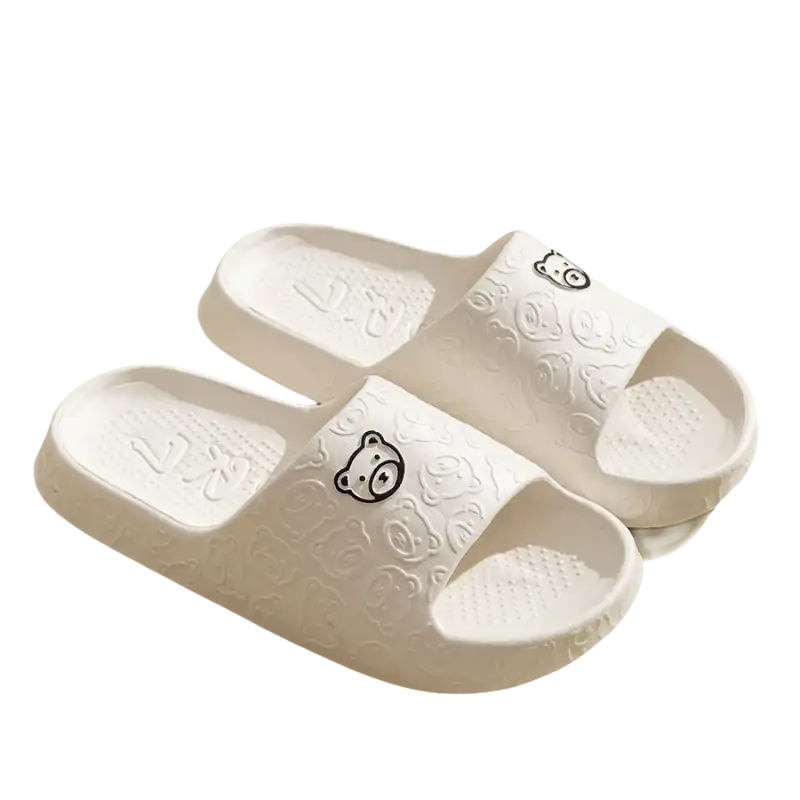 White bear-themed slide sandals.