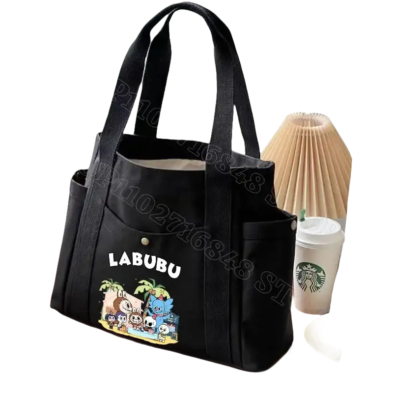 Black canvas tote bag with cartoon graphic.