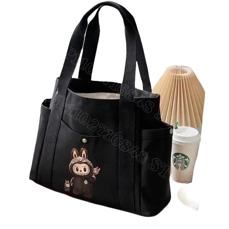 Black canvas tote bag with cartoon bunny.