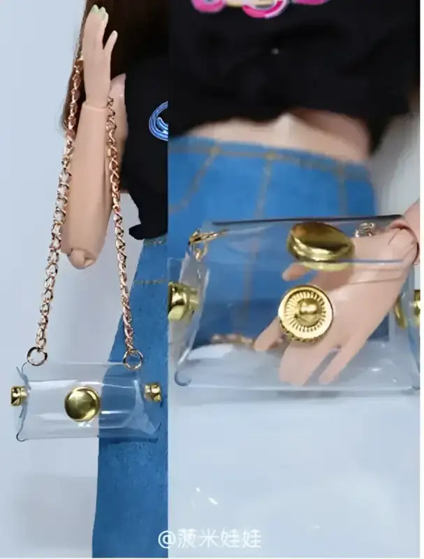 Clear plastic purse with gold accents and chain strap.