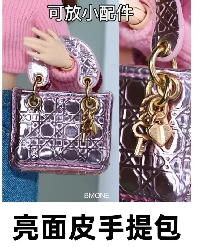 Shiny pink patterned handbag with gold charms.