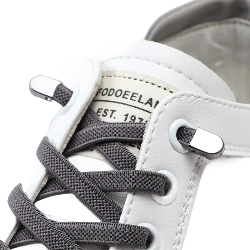 White leather sneaker with gray laces.