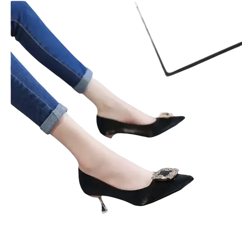 Black high heels with jeweled buckles.