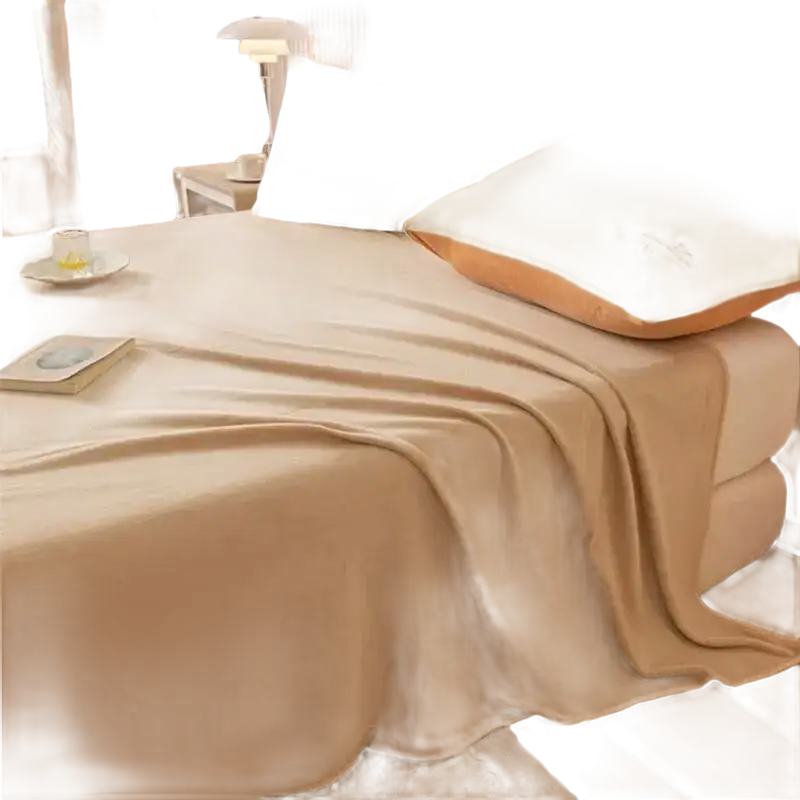 Beige blanket on a bed.